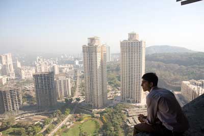 Jamal as a man looking over Mumbai