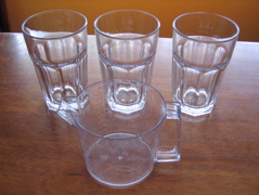 Three glasses and a measuring cup